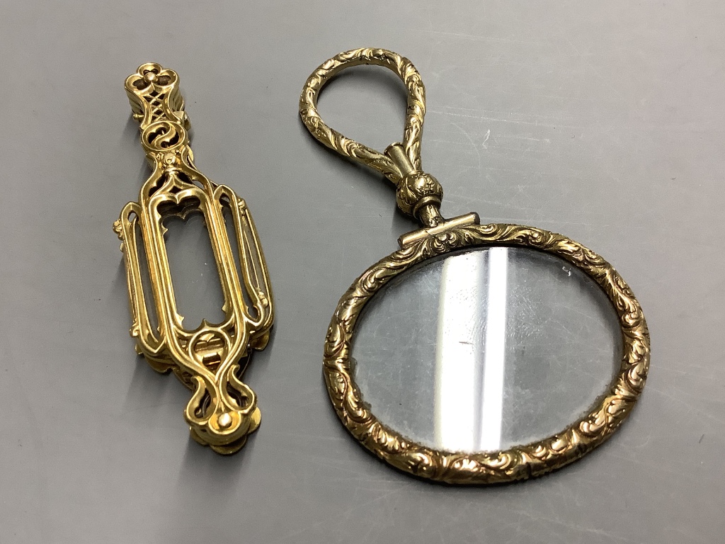 A late 19th century French yellow metal (18ct poincon mark) lorgnette and a yellow metal overlaid eye glass.